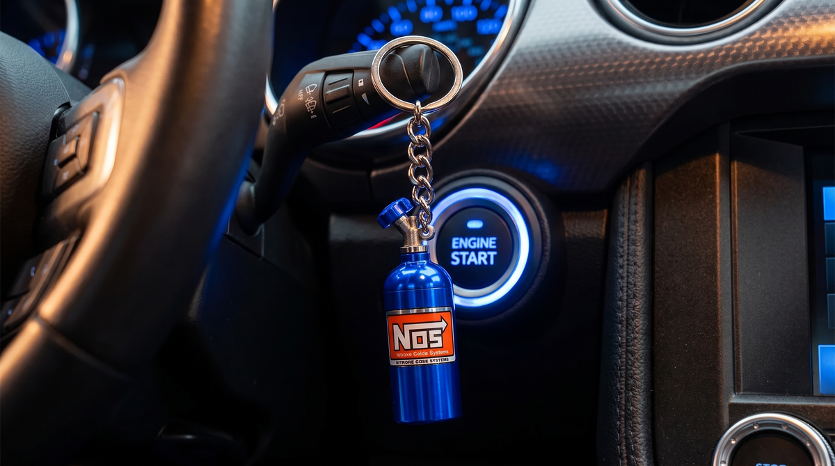 Nitro Bottle Keychain on car keys next to the engine start button